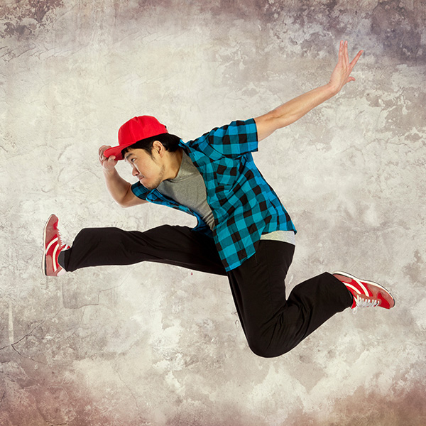 Asian man jumping mid-air